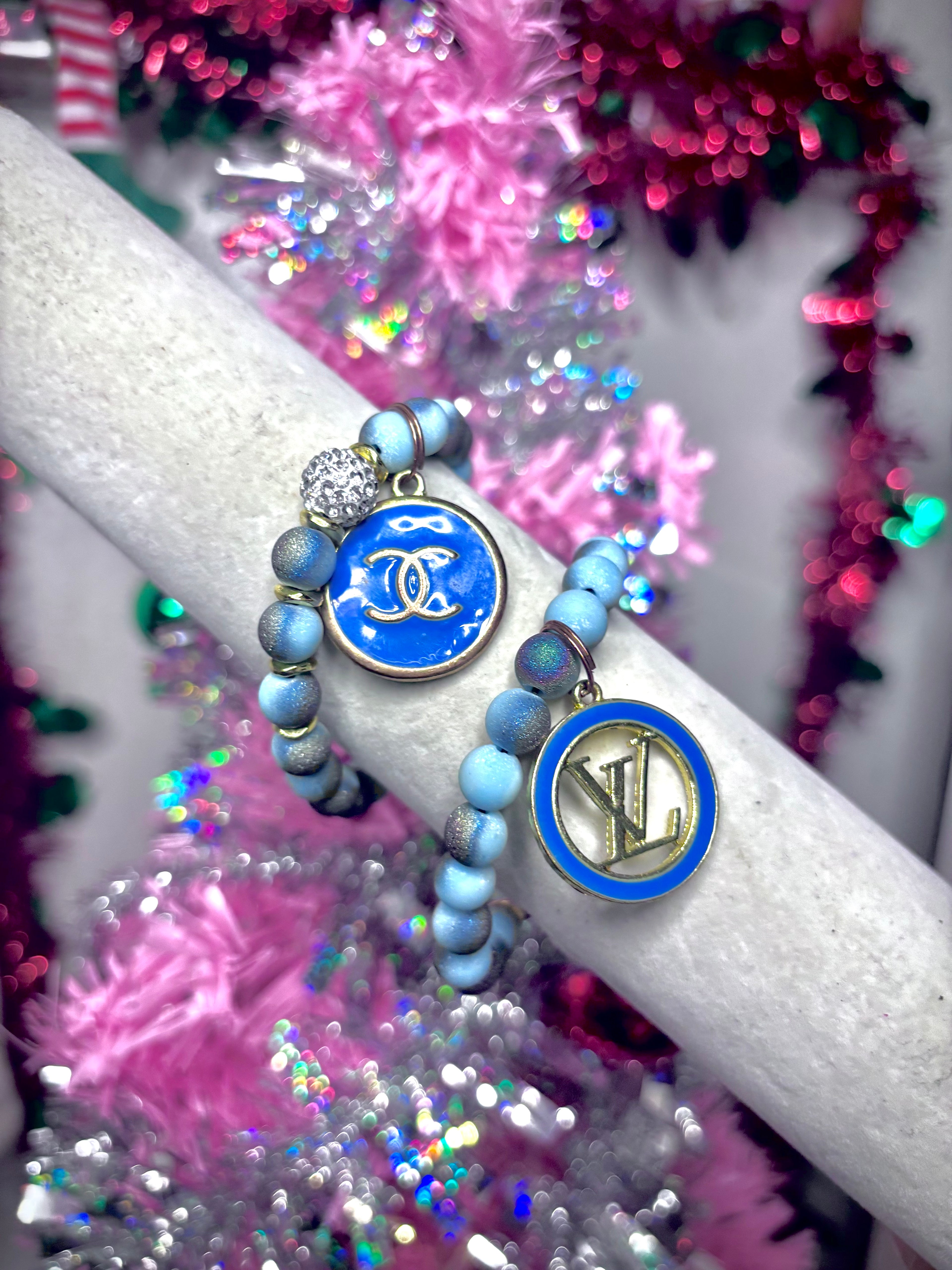 blue beaded bracelet with designer charm